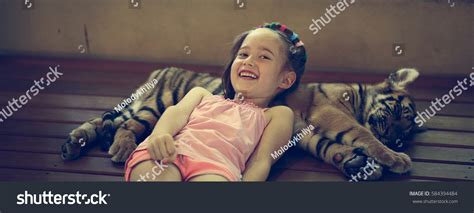 Little Girl Tiger Cub Stock Photo 584394484 Shutterstock