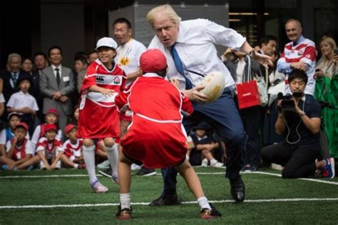 London Mayor Boris Johnson Rugby Tackles Schoolboy In Tokyo Japan