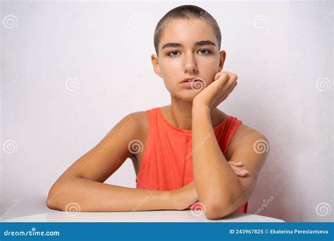 Caucasian Girl With Short Hair Almost Bald Holds Her Hands Behind Her Head Stock Image Image