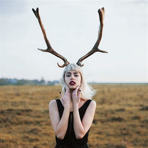 Portrait Of A Young Woman Wearing Deer Horns Stocksy United