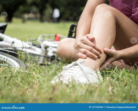 Concept Bike Accident Woman With Pain In Knee Joints After Biking On Bicycle In Park Ankle