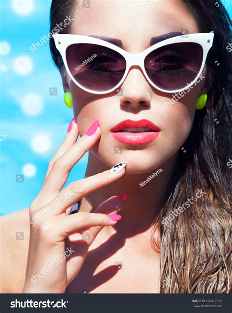 Colorful Portrait Of Young Attractive Woman Wearing Sunglasses By The