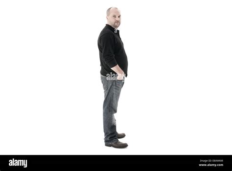 Full Length Shot Of A Man Standing Side On Shot On A White Background