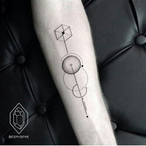 A Black And White Photo Of A Person S Arm With A Geometric Tattoo On It
