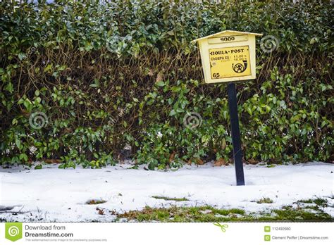 Bulgarian Mailbox In The Snow Against A Green Hedge Editorial Image