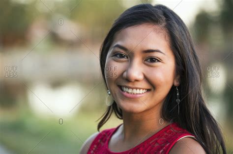 Portrait Of A Beautiful Young Filipino Woman Smiling In A City Park In Autumn St Albert