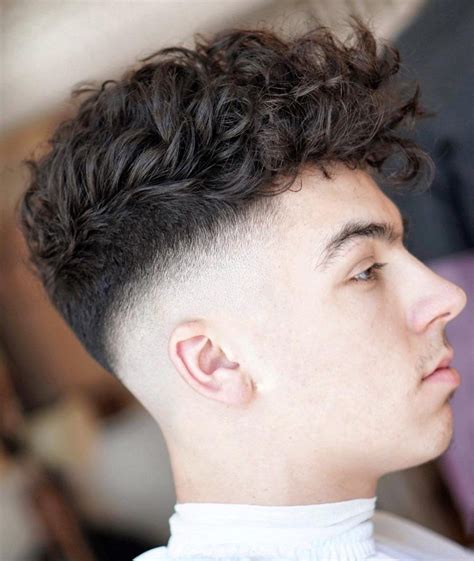 Tight curls made into a cup design and dyed into blonde, with finely shaved sides and contrasting beard, gives a very unique look. Shaved Sides Haircuts -> 17 Cool Fade Styles For August ...