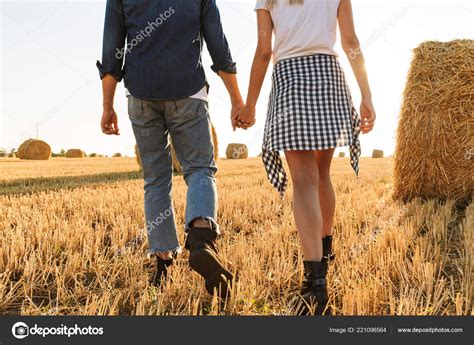 Cropped Photo Young Guy Girl Walking Golden Field Bunch Haystacks Stock