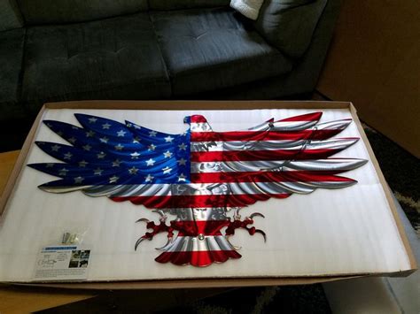 An American Eagle With The Colors Of The Flag Painted On Its Wings Is