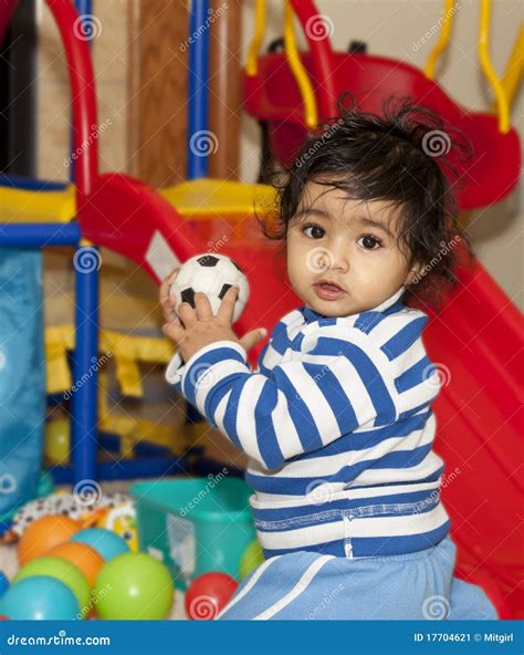 Baby Girl Playing With Balls In A Play Area Stock Image Image 17704621
