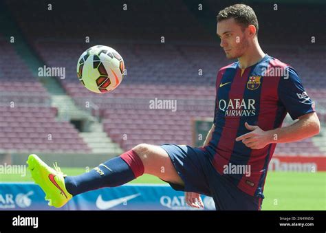 fc barcelona s new belgian thomas vermaelen controls the ball during his official presentation