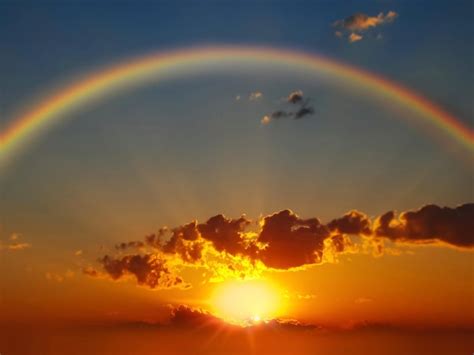 Premium Photo Rainbow At Sunset On Cloudy Sky At Sea