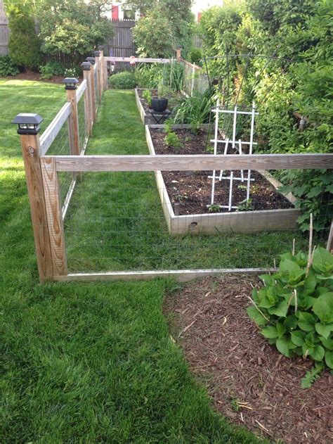 So you're wondering how to start a vegetable or kitchen garden? Homemade garden fence with raised beds | Small backyard gardens, Fenced vegetable garden ...