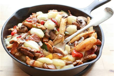 Montreal-Style Poutine with Bacon, Peppers, Mushrooms, and Onions 