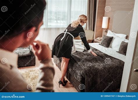 Slim Hotel Maid Standing With Her Back To Client Of The Hotel Stock Image Image Of Independent