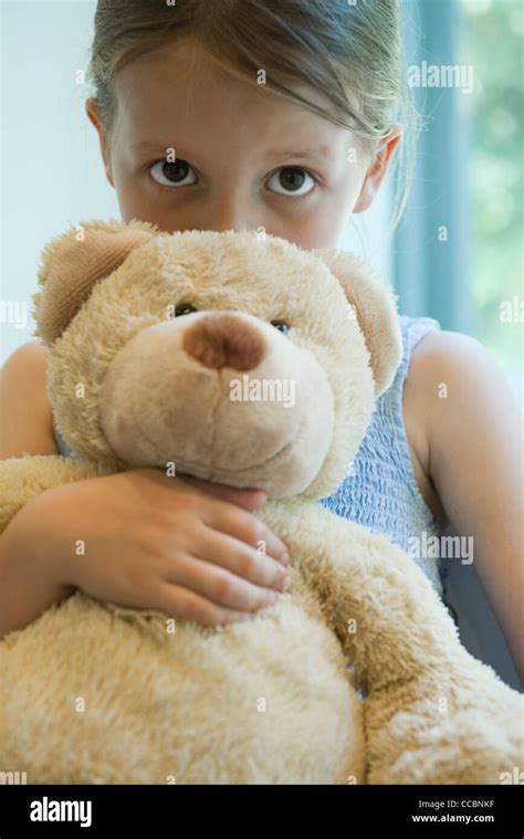 Little Girl Hugging Teddy Bear Stock Photo Alamy