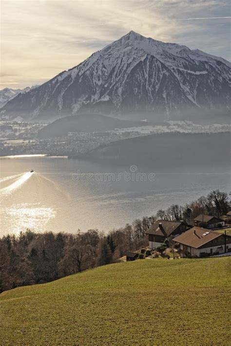 Sunrise In A Village Over The Thun Lake In Swiss Alps In Winter Stock