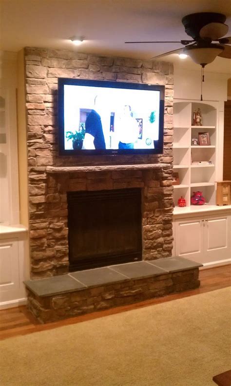 stone fireplace  tv  fireplace tv installation