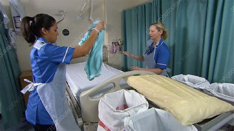 Nurses Making Hospital Bed Stock Video Clip K0014327 Science