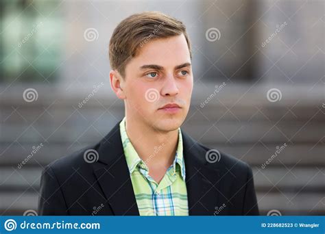 Young Handsome Man In Black Blazer Walking On Street Stock Image