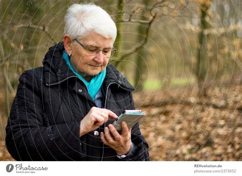 Oma Im Wald Mit Smartphone Ein Lizenzfreies Stock Foto Von Photocase