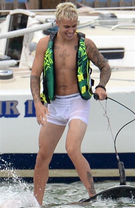 justin bieber goes wakeboarding in his white underwear photos herald sun
