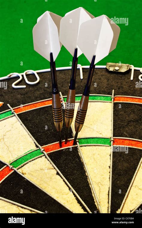 Three Darts Successfully Scoring One Hundred And Eighty In A Dartboard
