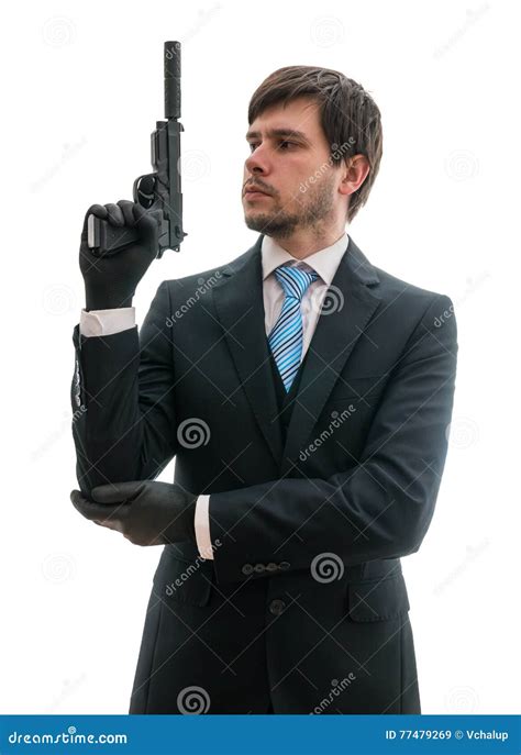 Man In Suit Holds Pistol With Silencer In Hand Isolated On White