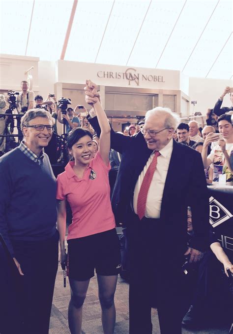 warren buffett and bill gates play ping pong with ariel hsing at borsheim s in omaha nebraska