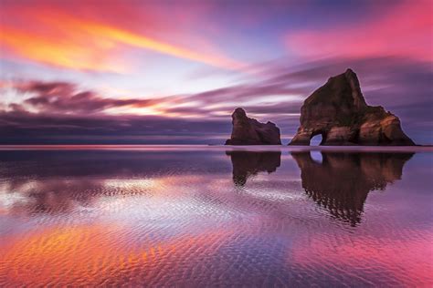 Sunset Reflection On A New Zealand Beach
