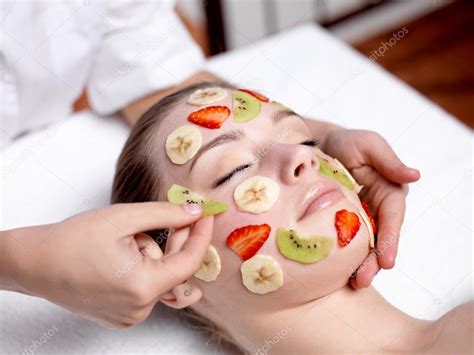 Woman Receiving Fruit Facial Mask At Spa Salon — Stock