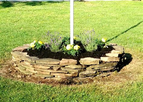 See more ideas about front yard, flag pole landscaping, front yard landscaping. Simple rock circle flower bed around flag pole (With ...