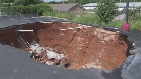 Car Swallowed In One Of Three Sink Holes Along The Same Jefferson City