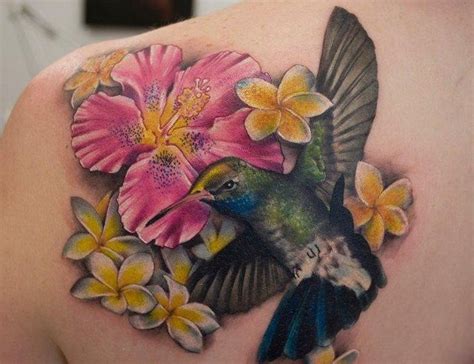 A work of art, it literally looks like you. Hummingbird and Hawaii flowers tattoo | Hummingbird tattoo ...