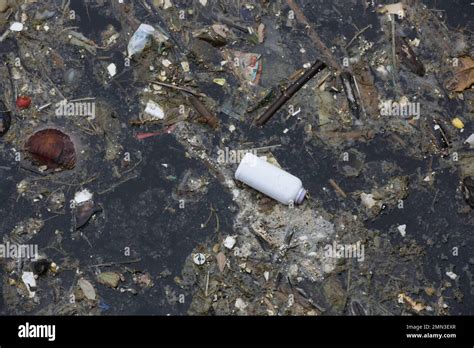 A giant floating rubbish heap floating in the river, plastic pollution