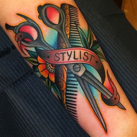 Colorful Scissor And Comb With Banner Tattoo