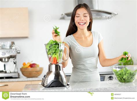 Green Smoothie Woman Making Vegetable Smoothies Stock