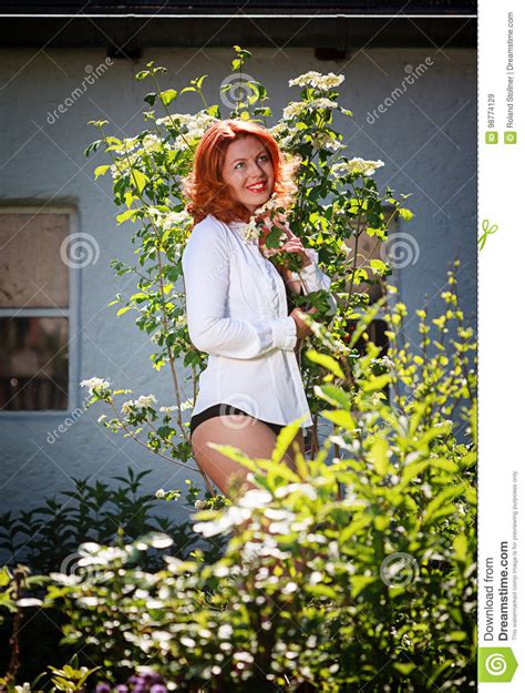 She Enjoys The Beauty Of Her Garden Stock Image Image Of Hair
