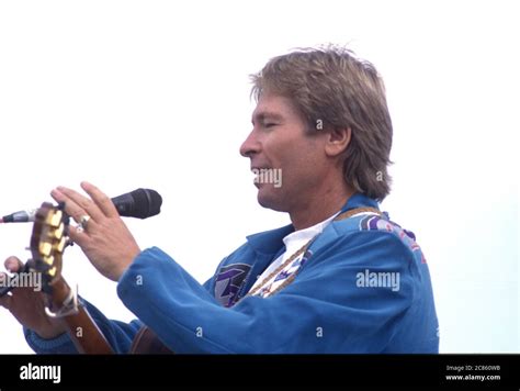 Singer John Denver Performs At An Earth Day Rally At The United States