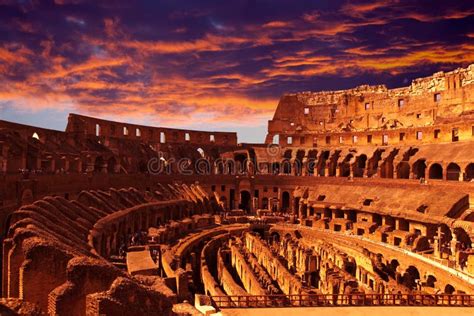 Bright Crimson Sunset Over The Ancient Colosseum During A Sunset Rome