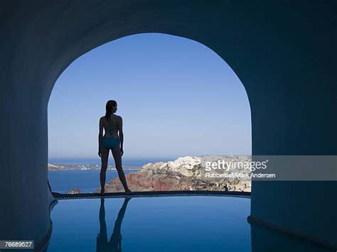 Woman Backlit Infinity Pool Photos And Premium High Res Pictures
