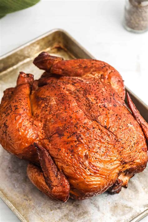Place the whole chicken in the smoker with 2 to 3 wood chunks spread through the hot coals. Smoked Whole Chicken Recipe - Little Sunny Kitchen
