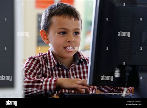 7 Year Old Boy Using Computer Hi Res Stock Photography And Images Alamy