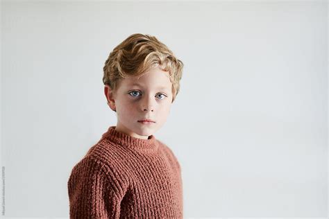 Portrait Of A Beautiful Six Year Old Child Looking At Camera With And