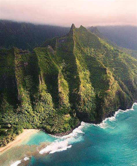 An Aerial View Of The Ocean And Mountains