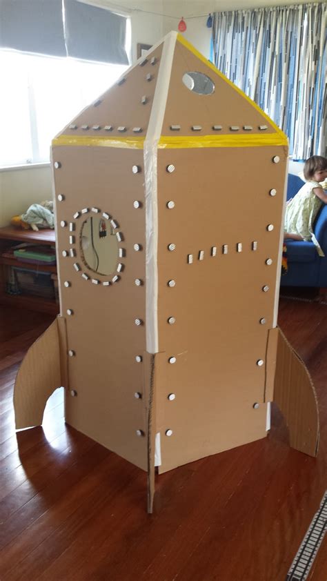 You must make a small cardboard box with enough room for your feet to fit in, and a hole at the top of the box. Making it up as I go: To the Moon!: The Cardboard Rocket Ship