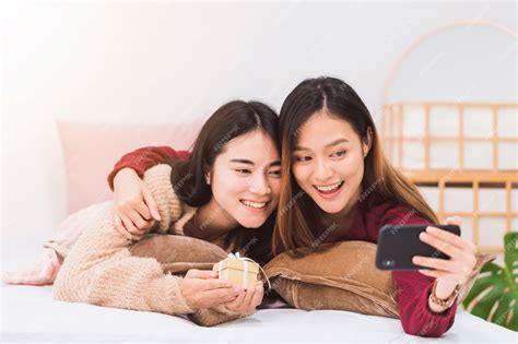 Premium Photo Young Beautiful Asian Women Lesbian Couple Lover Giving