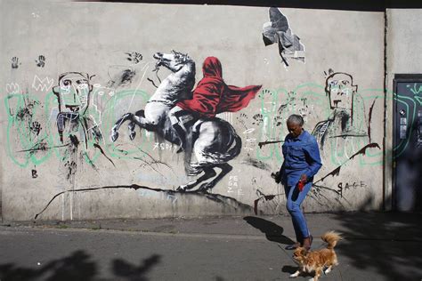 street artist banksy splashes paris with works on migrants chicago sun times