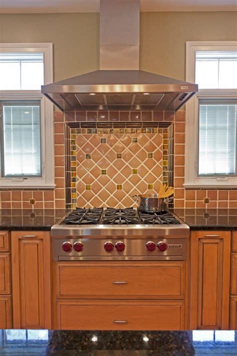 Each team tries to add the most value to their respective kitchens and dining rooms; Warm Tile Kitchen Backsplash & Stainless Range Hood | HGTV