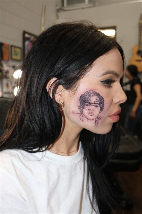 Which Singers Face Is Tattooed On This Womans Face